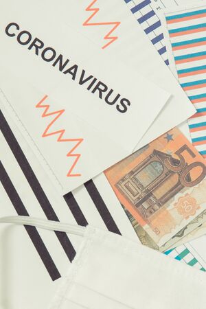 Currencies euro with downward graphs representing financial crisis caused by coronavirus