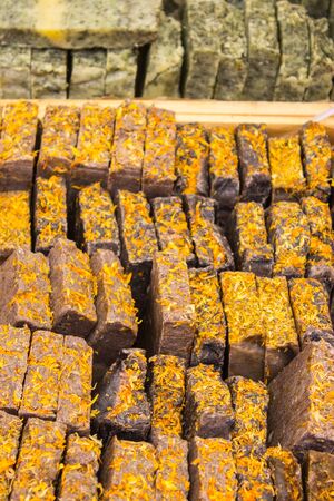 Natural aromatic handmade cinnamon soap on stall at bazaarの写真素材