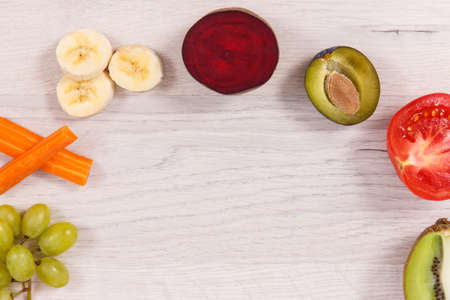 Fresh ripe fruits and vegetables containing natural vitamins, dietary fiber and minerals, healthy...