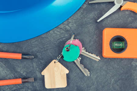 Keys with house shape and work tools for engineering work. Building home concept. Technology