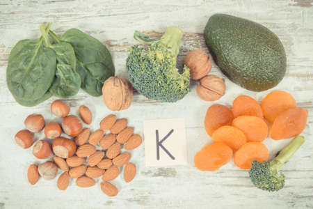 Vintage photo, Fresh fruits and vegetables containing vitamin K, potassium, dietary fiber and natural minerals, healthy nutrition conceptの写真素材