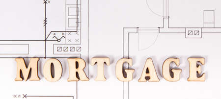 Inscription mortgage on electrical construction drawing, concept of buying or building house