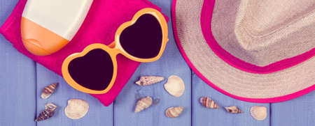Seashells in shape of sun and accessories for summer or vacation. Relaxation time