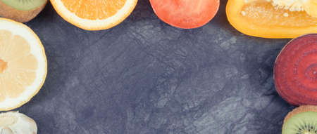 Frame of fresh ripe fruits with vegetables. Source vitamins and minerals. Place for text or...
