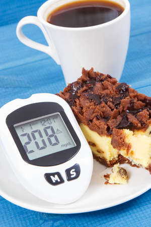 Glucometer with bad result of measurement sugar level and fresh baked cheesecake with black coffee. Dieting during diabetesの写真素材