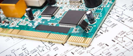 Printed circuit board with transistors, resistors, capacitor. Diagram of electronics. Technology