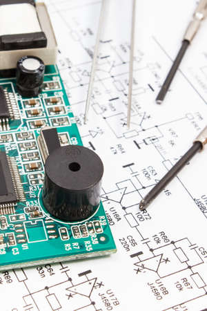 Printed circuit board with transistors, resistors, capacitor. Diagram of electronics and precision...
