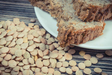 Green lentil seeds containing natural vitamins and fresh baked homemade pate. Healthy eatingの写真素材
