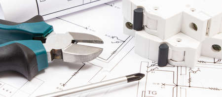 Work tools, electric fuse and diagrams of plan with electrical installation.