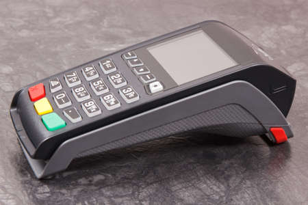 Credit card reader as device using for cashless paying. Payment terminal. Finance and banking conceptの写真素材