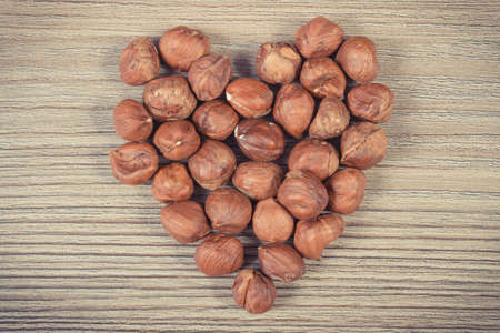 Heart shaped hazelnuts. Source natural vitamins and minerals. Healthy eatingの写真素材