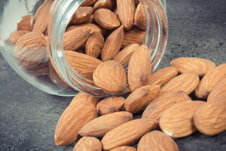 Fresh healthy almonds containing natural vitamins and minerals. Nutritious eatingの写真素材