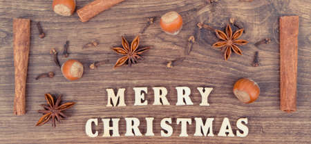 Inscription Merry Christmas and ingredients for festive baking and cookingの写真素材