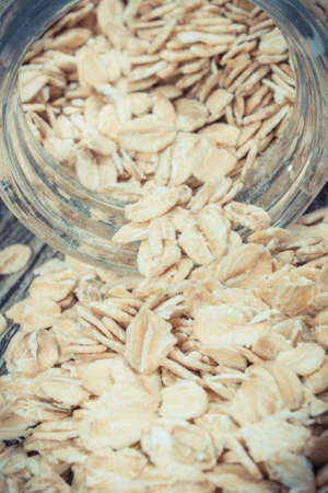 Heap of healthy rye flakes or oat bran as source dietary fiber and natural minerals. Nutritious eatingの写真素材