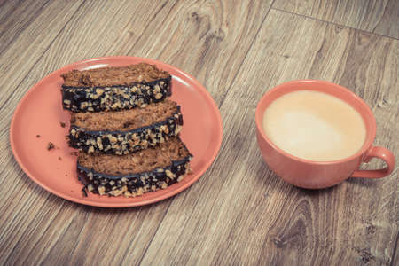 Fresh baked homemade pastry made of zucchini and cup of white coffee. Delicious dessertの写真素材