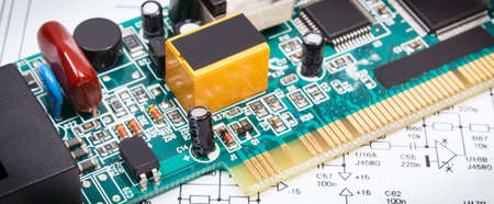 Printed circuit board with transistors, resistors, capacitor. Diagram of electronics. Technology