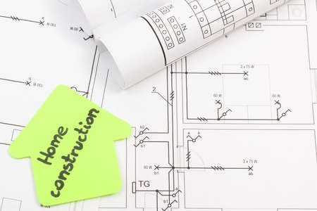 House shape made of paper with inscription home construction and electrical construction housing plan. Building home concept. Technologyの写真素材