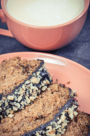 Fresh baked zucchini dough and cup of white coffee. Delicious dessert