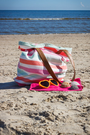 Accessories for relax or sunbathing on sand at beach. Travel and vacation time conceptの写真素材