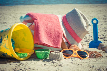 Accessories for relax or sunbathing and children toys for playing on sand at beach. Travel and vacation time conceptの写真素材