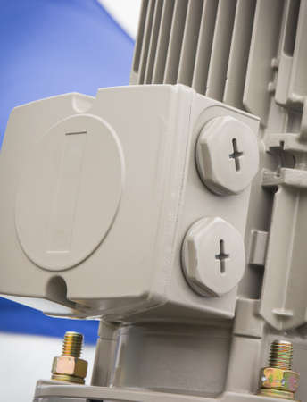 Gray electrical box used for wiring connections and part of electric engine. Technology and detail of industrial machineの写真素材