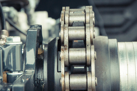Metal chain and gear in agricultural and industrial machine. Technology concept