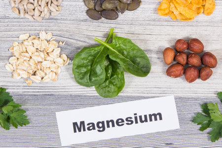 Inscription magnesium, healthy nutritious food and various ingredients containing natural magnesium and other vitamins and mineralsの写真素材