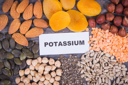 Inscription potassium with nutritious various ingredients containing natural minerals and vitamin Kの写真素材