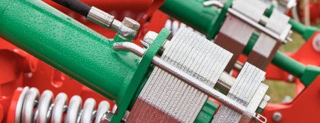 Silver and green mechanism in hydraulic or pneumatic machine. Industrial or agricultural machine....