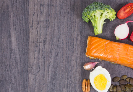 Healthy food containing selenium, dietary fiber and other vitamins and minerals. Place for text or inscription on black boardの写真素材