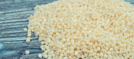 Heap of fresh healthy millet groats as source natural vitamins and minerals. Nutritious eatingの写真素材