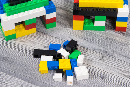 Small houses made of colorful toy blocks. Development of children coordination and creativity