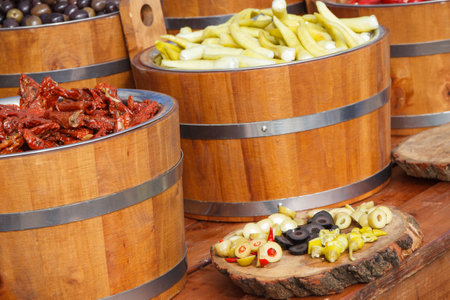 Fresh peppers and olives for sale at street market. Healthy food containing natural vitamins....