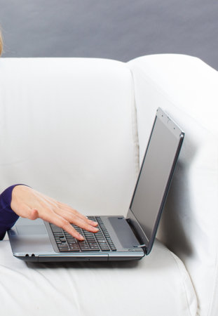 Hands of woman with laptop. Relaxing or working with computer. Modern technologyの写真素材