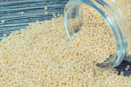 Heap of fresh healthy millet groats as source natural vitamins and minerals. Nutritious eating
