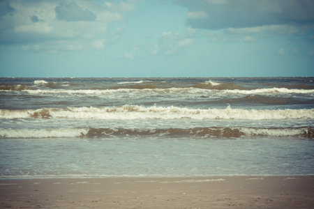 View on beach and sea waves. Stormy and windy day at sea.の写真素材