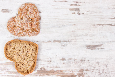 Fresh baked homemade wholegrain bread in shape of heart for breakfast. Copy space for text or...