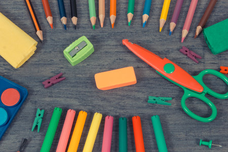 Different colorful stationery accessories and school supplies. Learning, drawing, writing, developing creativity. Kids motor skillsの写真素材