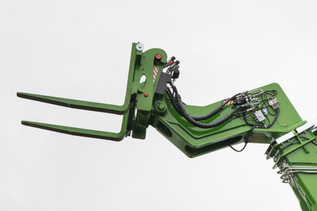 Forklift loader or stacker. Detail and part of hydraulic and pneumatic mechanism in industrial...