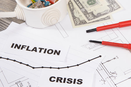 Electrical components, work tools, installation plan, Dollar currencies, inscriptions inflation and crisis. Concept of high prices of building or renovation homeの写真素材