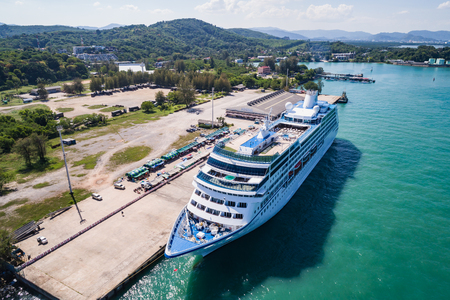 PHUKET, THAILAND - APRIL 16 : Big cruise ship 'Insignia' standing at the harbour on April 16, 2017 in Phuket, Thailand. Aerial view from flying droneのeditorial素材