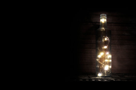 Bottle with lights on black backgroundの写真素材