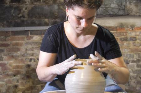 Woman making potteryの写真素材