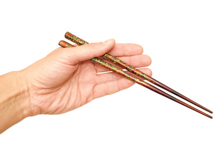 Chopsticks in a handの写真素材