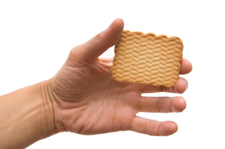 Cookies in a hand on the whiteの写真素材