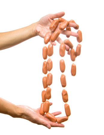Sausages in hands on a white backgroundの写真素材