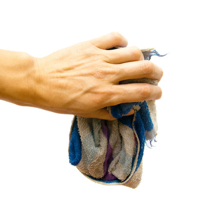 Rag in a hand on a white backgroundの写真素材