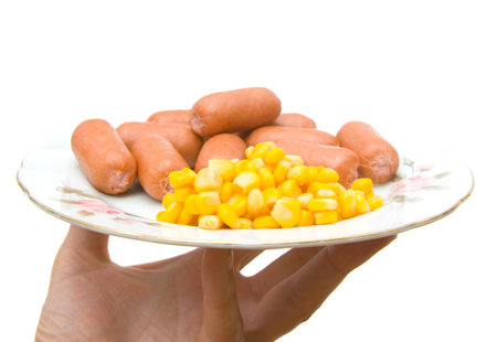 Sausages in hand on a white backgroundの写真素材