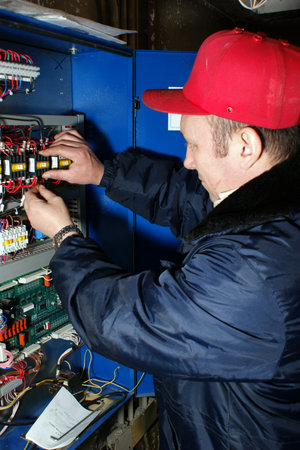 The mechanic makes planned repair of elevators in an apartment houseのeditorial素材