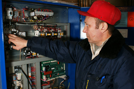 The mechanic makes planned repair of elevators in an apartment houseのeditorial素材